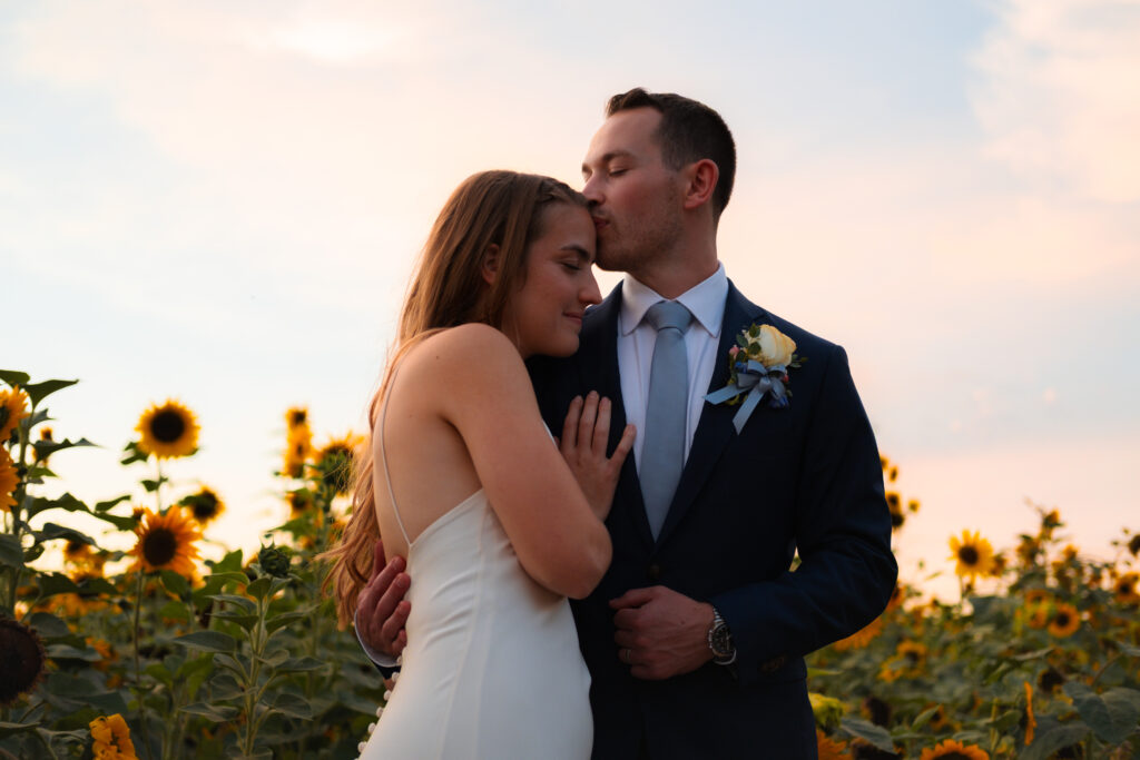 Portrait of couple in sunflower garden